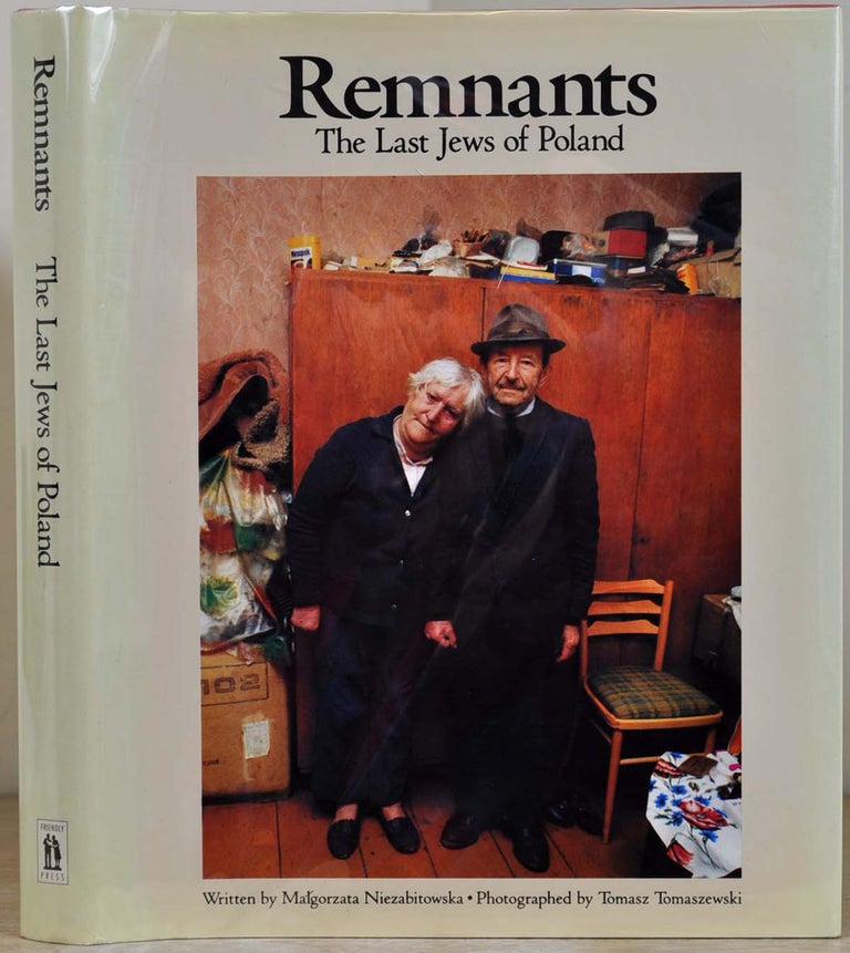 Item #012383 REMNANTS: The Last Jews of Poland. Signed by the author Malgorzata Niezabitowska and the photographer Tomasz Tomaszewski. Malgorzata Niezabitowska, Tomasz Tomaszewski.