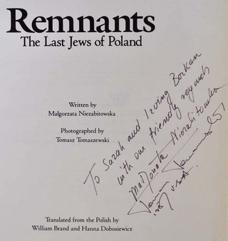 REMNANTS: The Last Jews of Poland. Signed by the author Malgorzata Niezabitowska and the photographer Tomasz Tomaszewski.