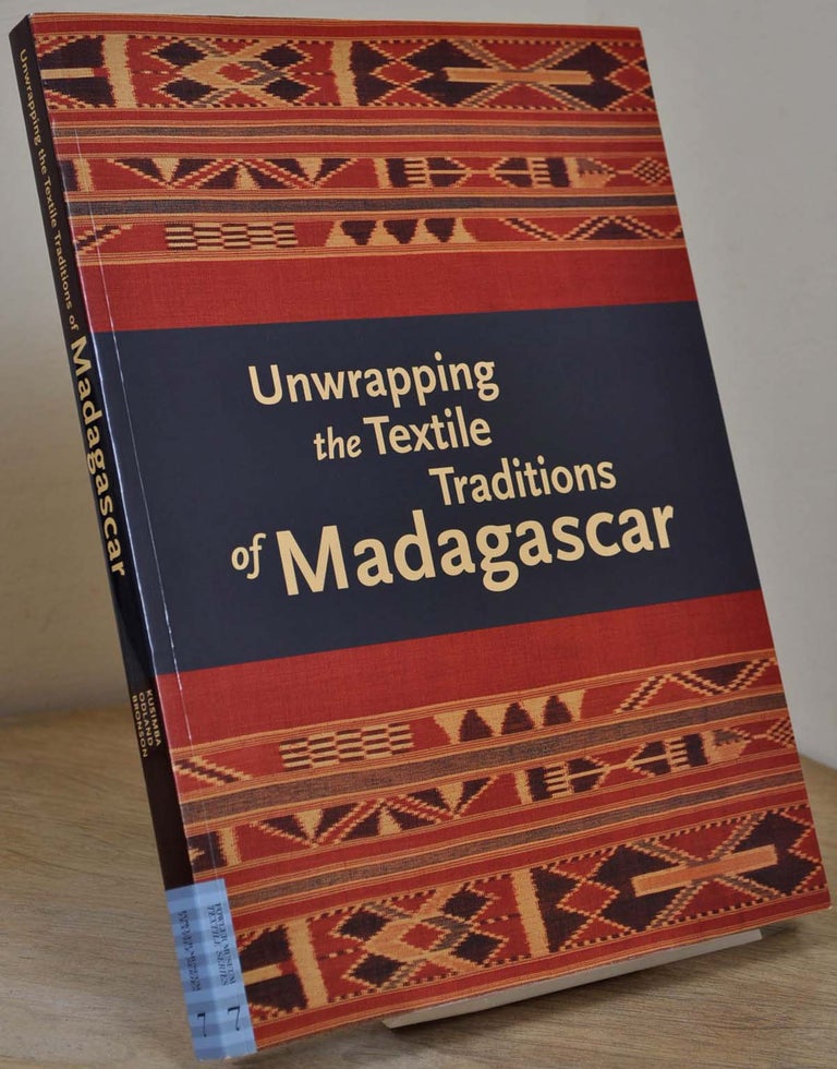 Item #015838 UNWRAPPING THE TEXTILE. Traditions of Madagascar. Signed by Chap Kusimba. Chapurukha Makokha Kusimba.